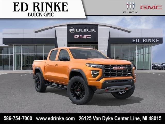 2026 GMC Canyon AT4 in Desert Sun — front three-quarter view