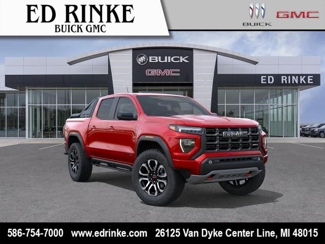 2026 GMC Canyon AT4 in Volcanic Red Tintcoat — front three-quarter view