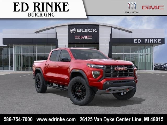 2026 GMC Canyon AT4 in Volcanic Red Tintcoat — front three-quarter view